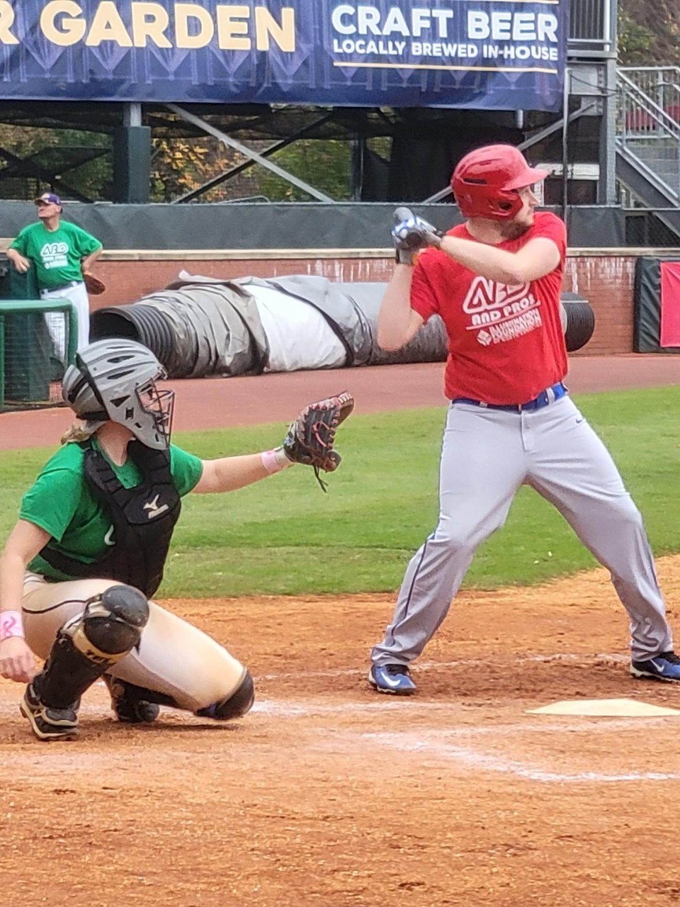 315492457_836978370956434_1984372099375742524_n baseball player swing a bat with a catcher behind him at home plate