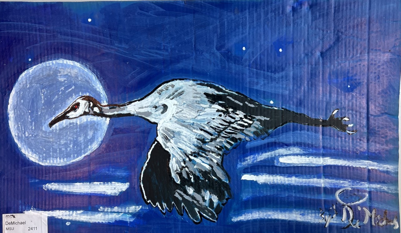 "Flight Towards the Light" by DeMichael a painting of a blue night sky and silver moon with a large white and black bird, possibly a heron, flying in front of it