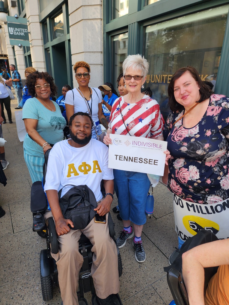 BG 115 IL article - SILC team in DC A photo of Tennessee's racially diverse CIL directors posing on a D.C. sidewalk together during this year's conference