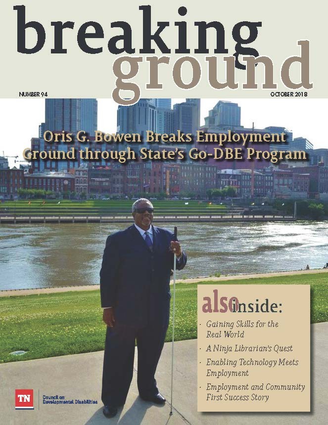 Breaking Ground 94 cover of magazine showing a blind african american man wearing sunglasses and holding a white cane in front of the nashville skyline and cumberland river downtown, standing in the sunlight; he's wearing a nice black suit; the text says "breaking ground: october 2018 - oris G. Bowen breaks employment ground through state's Go DBE program"; also lists other articles in the magazine