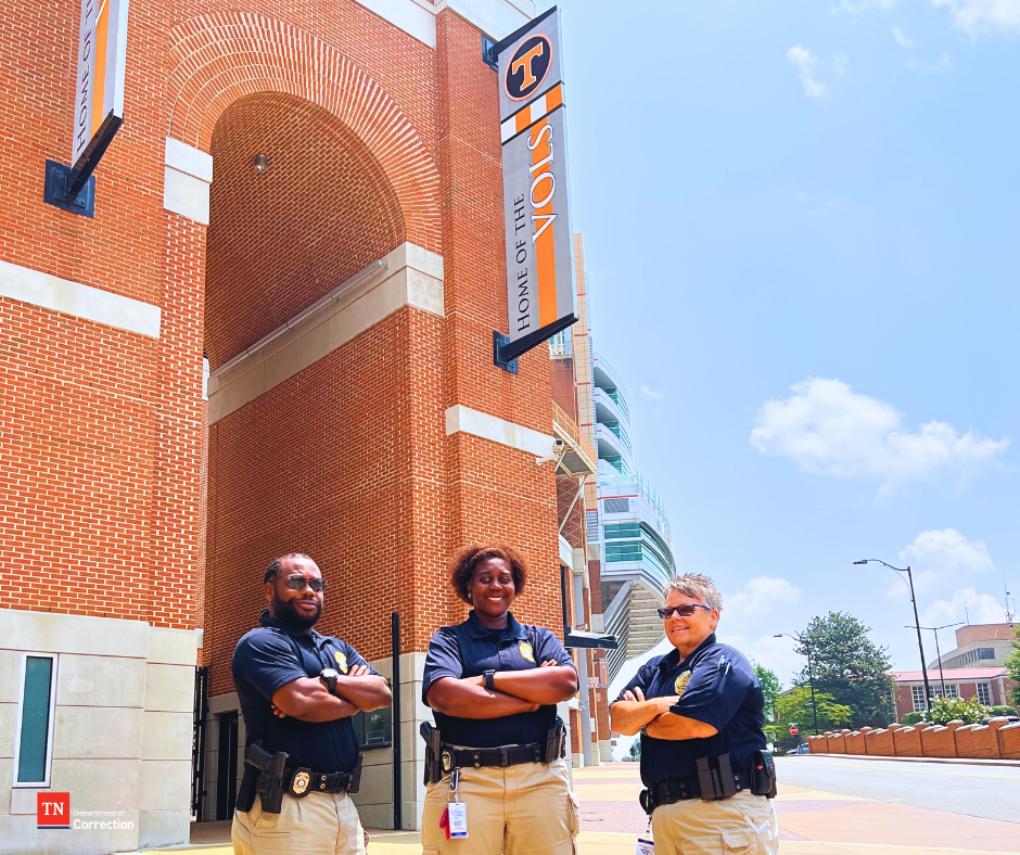 Photo of probation parole officers with Vols background
