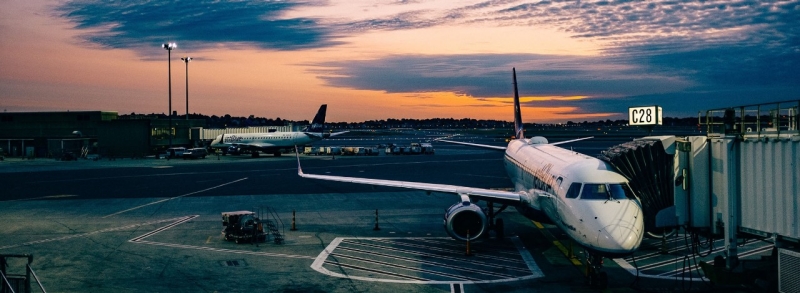 air plane parked at boarding gate