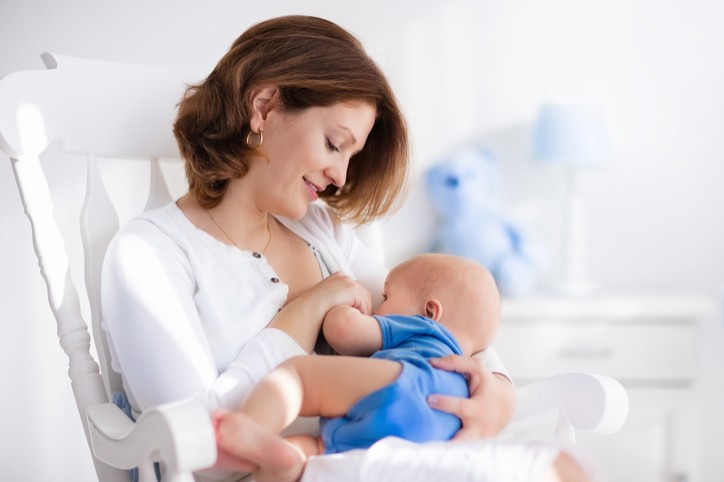 Mother nursing infant Mother nursing infant