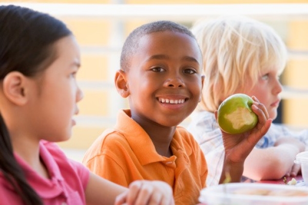 child eating apple