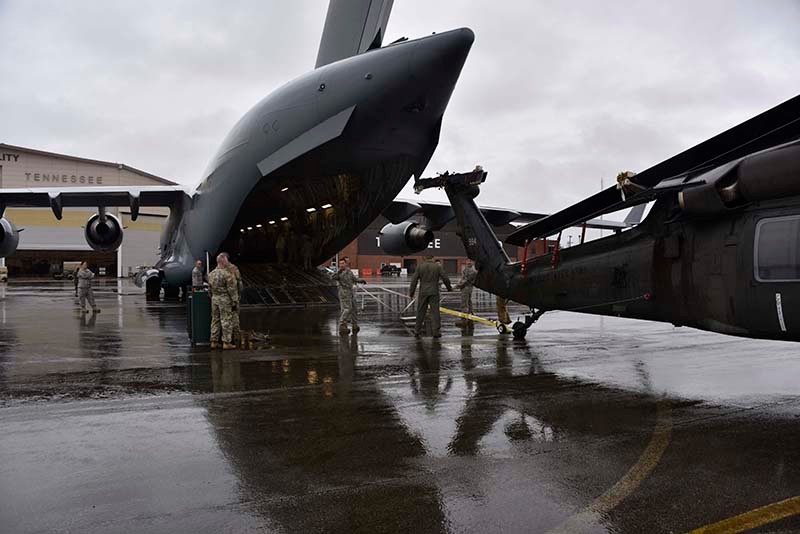 PHOTO CAPTION 1 & 2:  Tennessee National Guard Soldiers push a UH-60 Blackhawk into a C-17 aircraft carrier Sept. 13 at Joint Base Berry Field, Nashville, Tennessee. The Tennessee National Guard deployed to the U.S. Virgin Islands to support disinter relief efforts and provide humanitarian aid in the aftermath of Hurricane Irma. (Photo by Spc. Lauren Ogburn, Tennessee National Guard Public Affairs Office).