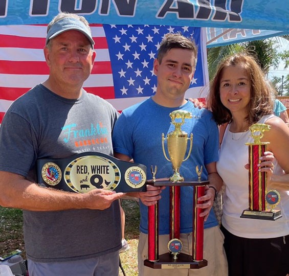 Col. Bradley Ball, Staff Sgt. Christian Ball, and Lori Ball following a BBQ competition in Panama City, Florida. (Photo provided by Col. Bradley Ball) Col. Bradley Ball, Staff Sgt. Christian Ball, and Lori Ball following a BBQ competition in Panama City, Florida. (Photo provided by Col. Bradley Ball)