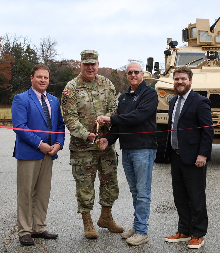 Gibson County Mayor Nelson Cunningham, Brig. Gen. Warner Ross, Tennessee’s Assistant Adjutant General-Army, Milan Mayor B.W. Beasley, and Carroll County Mayor Joseph Butler cut a ceremonial ribbon at the Milan Volunteer Training Site during a ceremony in Milan on Dec. 6. (photo by: Capt. Kealy Moriarty) Gibson County Mayor Nelson Cunningham, Brig. Gen. Warner Ross, Tennessee’s Assistant Adjutant General-Army, Milan Mayor B.W. Beasley, and Carroll County Mayor Joseph Butler cut a ceremonial ribbon at the Milan Volunteer Training Site during a ceremony in Milan on Dec. 6. (photo by: Capt. Kealy Moriarty)