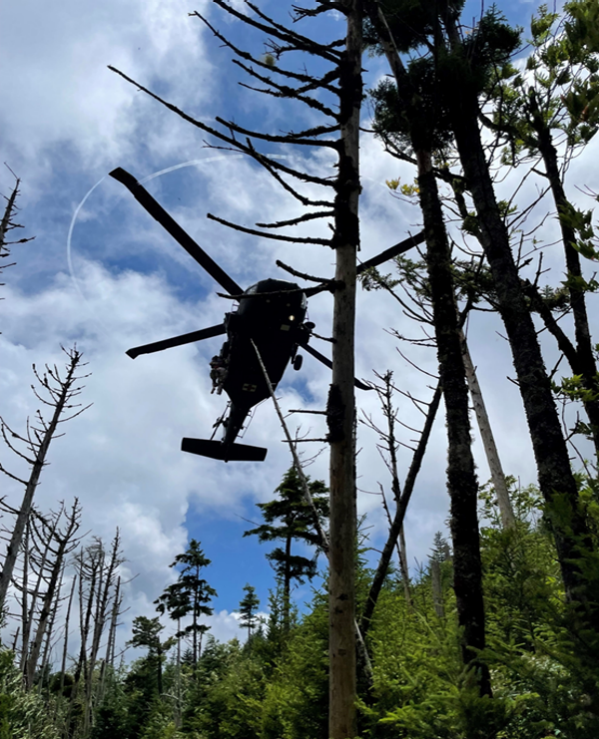 A Tennessee Army National Guard UH-60 Blackhawk helicopter aircrew prepares to hoist a hiker with a life-threatening illness, and a Tennessee National guard Flight Paramedic, into the helicopter on Mount LeConte at the Great Smoky Mountain National Park area, July 19. (Photo from the Tennessee National Guard) A Tennessee Army National Guard UH-60 Blackhawk helicopter aircrew prepares to hoist a hiker with a life-threatening illness, and a Tennessee National guard Flight Paramedic, into the helicopter on Mount LeConte at the Great Smoky Mountain National Park area, July 19. (Photo from the Tennessee National Guard)