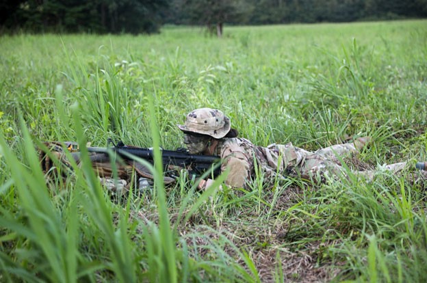 U.S. Air Force Staff Sgt. Samantha Sheridan, a participant of the patrol course, maintains perimeter security during the two-week patrol course, Aug. 6-20, held in Lavinia. (Photo by Capt. Kealy Moriarty) U.S. Air Force Staff Sgt. Samantha Sheridan, a participant of the patrol course, maintains perimeter security during the two-week patrol course, Aug. 6-20, held in Lavinia. (Photo by Capt. Kealy Moriarty)