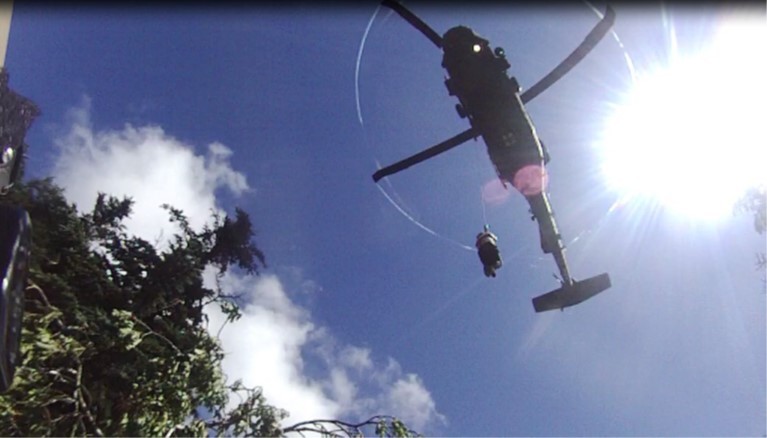 A sick hiker is hoisted into a hovering Tennessee Army National Guard Blackhawk helicopter during a rescue at the Great Smoky Mountains National Park, July 27. (Submitted photo) A sick hiker is hoisted into a hovering Tennessee Army National Guard Blackhawk helicopter during a rescue at the Great Smoky Mountains National Park, July 27. (Submitted photo)