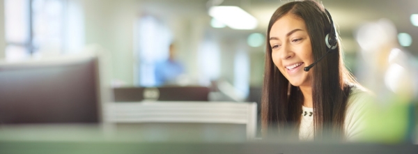 Woman on phone in call center Woman on phone in call center