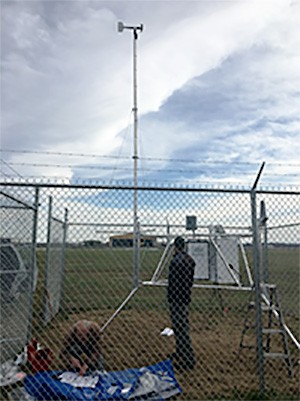 Remote Automatic Weather Station in Tipton County being serviced Remote Automatic Weather Station in Tipton County being serviced