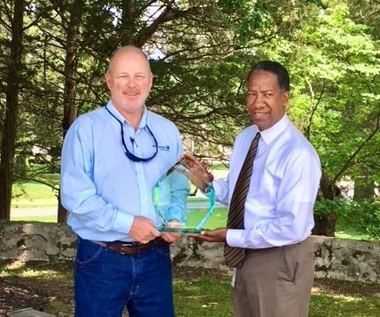 Roger Alley, Royal Blue Chip Mill Supervisor, left, and TDLWD Deputy Commissioner Dewayne Scott